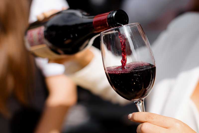 red-wine-poured-into-a-glass red wine making - wine poured into a glass